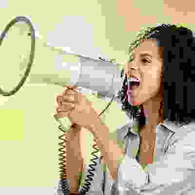 woman shouting into a loudspeaker