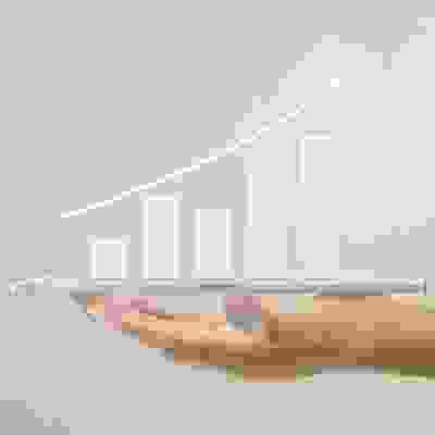 hand holding a tablet with a trending upwards graph